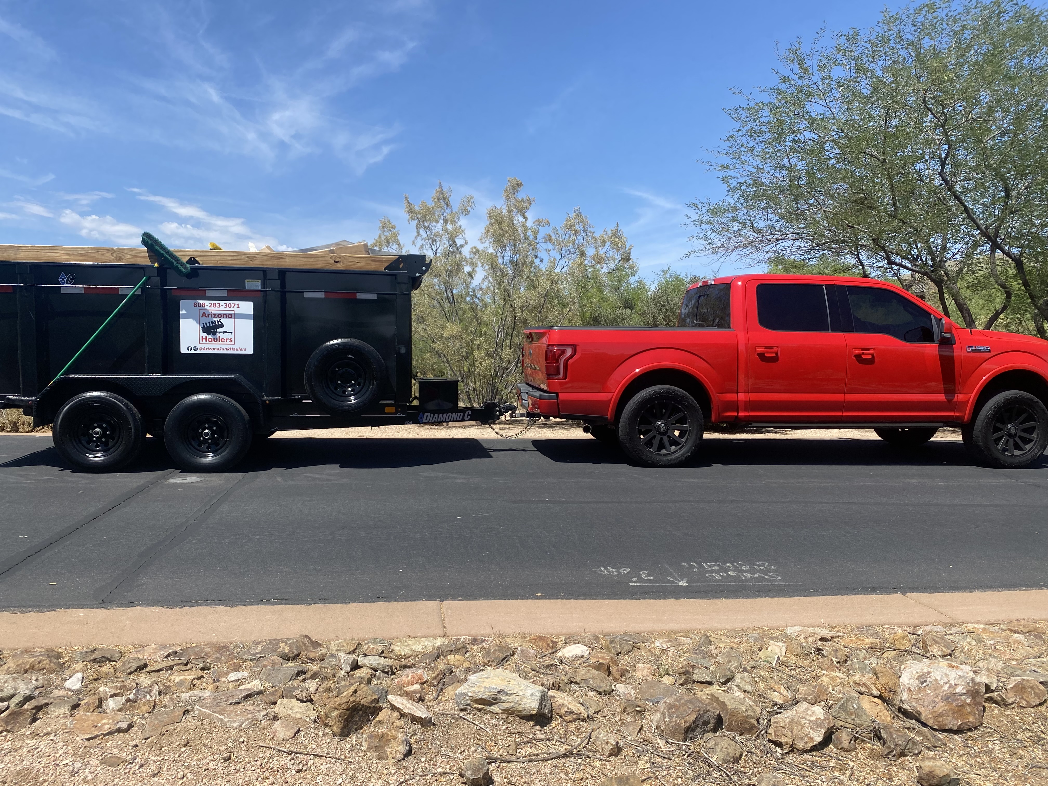Trash Away truck and dump trailer parked in a Phoenix-area neighborhood